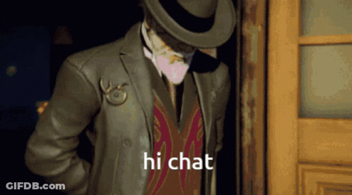 A Man In A Suit And Hat Is Standing In A Doorway And Says Hi Chat GIF