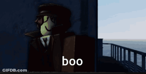 A Man In A Suit And Hat Says Boo GIF