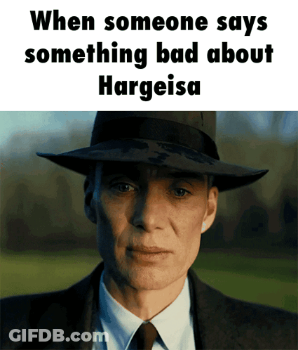 A Man In A Suit And Hat Says Something Bad About Hargeisa GIF