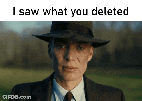 A Man In A Suit And Hat With The Words " I Saw What You Deleted " Above Him GIF