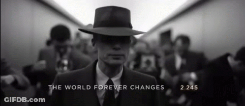 A Man In A Suit And Hat With The Words " The World Forever Changes " On The Bottom GIF