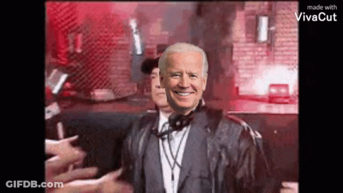 Man In Suit And Headphones Standing In Front Of Crowd GIF