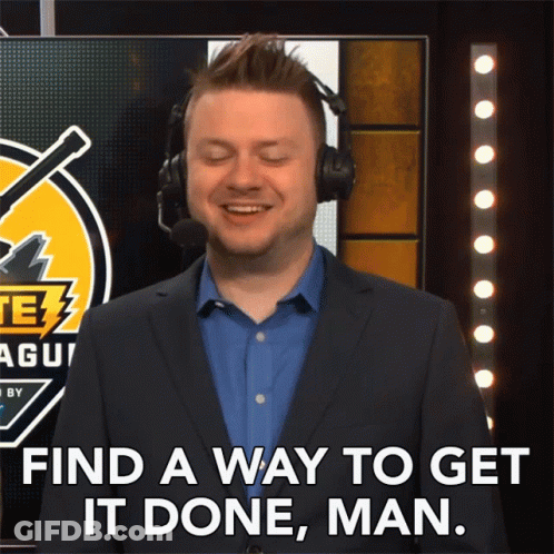 A Man In A Suit And Headphones Says " Find A Way To Get It Done Man " GIF