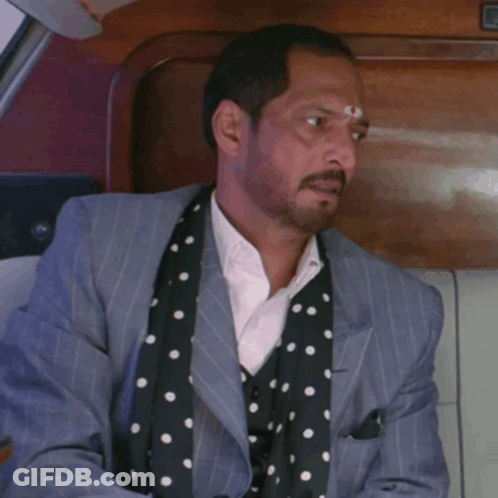 A Man In A Suit And Polka Dot Scarf Is Sitting In A Car With The Words Ye Raaz Bi Usi K Saath Ch GIF