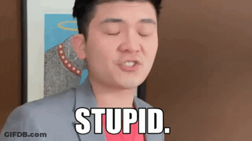 A Man In A Suit And Red Shirt Says Stupid GIF