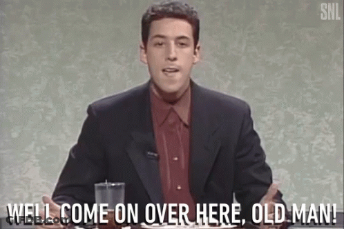 A Man In A Suit And Red Shirt Says Well Come On Over Here Old Man . GIF