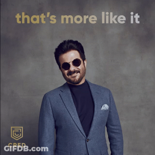 A Man In A Suit And Sunglasses Gives A Thumbs Up With The Words That 'S More Like It Behind Him GIF