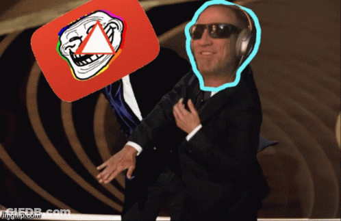 A Man In A Suit And Sunglasses Holds Up A Troll Face And A Youtube Logo GIF