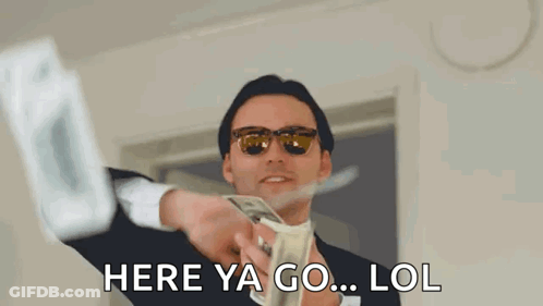 A Man In A Suit And Sunglasses Is Holding A Bunch Of Money In His Hand . GIF