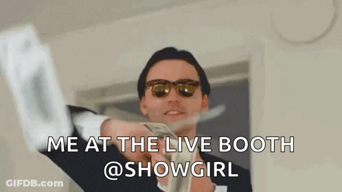 A Man In A Suit And Sunglasses Is Holding A Bunch Of Money In His Hands . GIF
