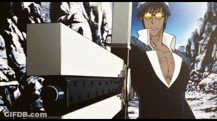 A Man In A Suit And Sunglasses Is Standing In Front Of A Mountain Holding A Gun . GIF