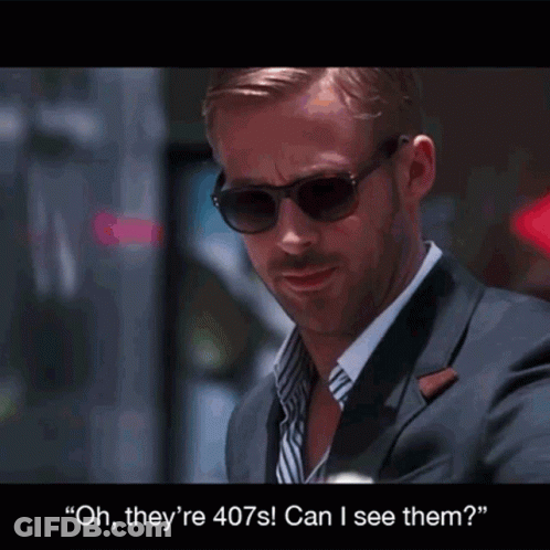 A Man In A Suit And Sunglasses Says " Oh They 'Re 407S Can I See Them ? " GIF