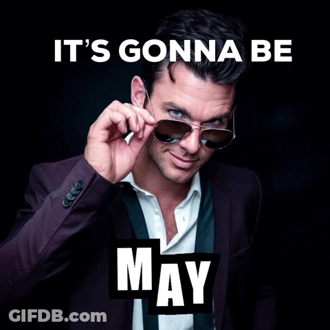 A Man In A Suit And Tie Adjusts His Sunglasses With The Words It 'S Gonna Be May Below Him GIF