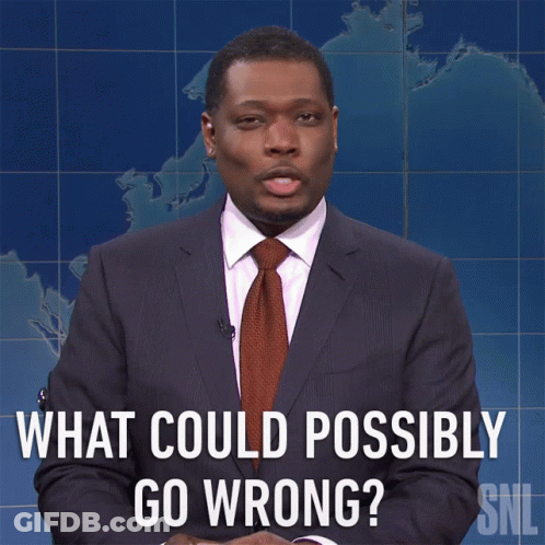 A Man In A Suit And Tie Asks What Could Possibly Go Wrong GIF