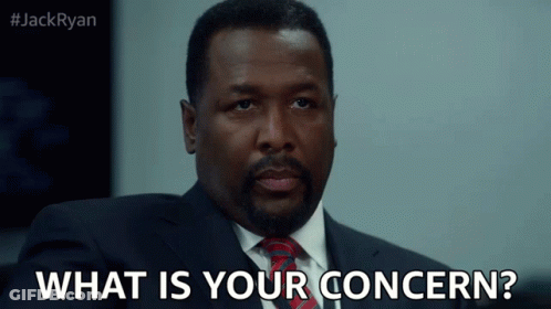 A Man In A Suit And Tie Asks " What Is Your Concern " GIF