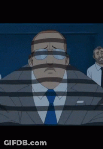 A Man In A Suit And Tie Behind Bars With A Striped Face GIF