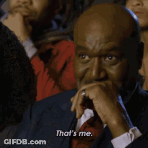 Man In Suit Covering Mouth Says That's Me GIF