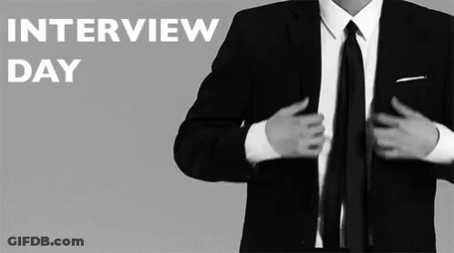 A Man In A Suit And Tie Getting Ready For An Interview Day GIF