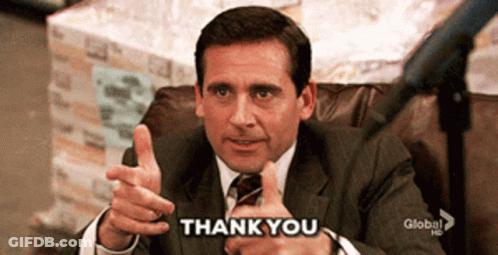 A Man In A Suit And Tie Giving A Thumbs Up With The Words Thank You Below Him GIF
