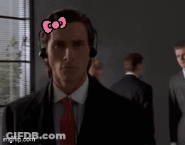 Man In Suit With Hello Kitty Bow On Forehead GIF