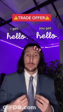 Man In Suit With Hello Kitty Bow On Forehead GIF