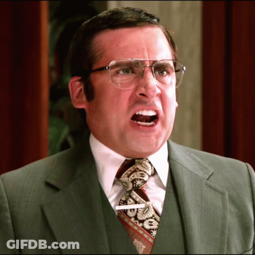 A Man In A Suit And Tie Has A Name Tag That Says ' Steve ' On It GIF