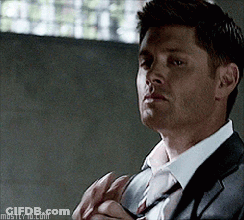 A Man In A Suit And Tie Has The Website Mostly10.com At The Bottom GIF
