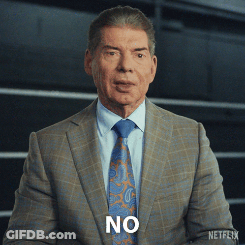 A Man In A Suit And Tie Has The Word No On His Face GIF