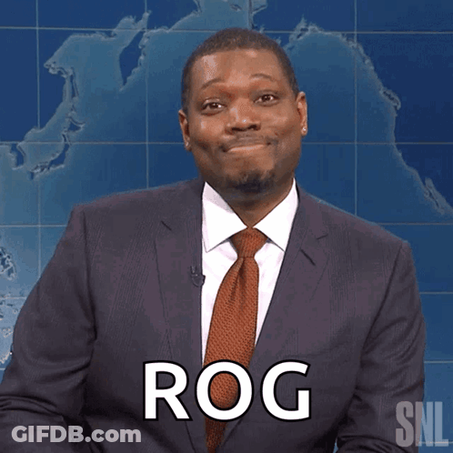A Man In A Suit And Tie Has The Word Rog On His Chest GIF