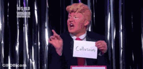 A Man In A Suit And Tie Holding A Sign That Says Collusion GIF