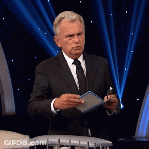 A Man In A Suit And Tie Holds A Box That Says One Million GIF