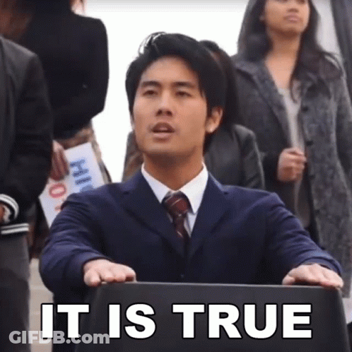A Man In A Suit And Tie Holds A Briefcase With The Words It Is True On It GIF