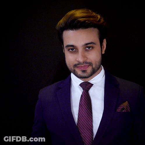 A Man In A Suit And Tie Holds A Glass In Front Of His Face With The Words For Your Success Written Below Him GIF