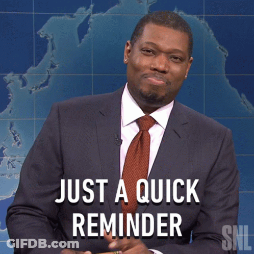 A Man In A Suit And Tie Holds A Pencil In Front Of A Sign That Says Just A Quick Reminder GIF
