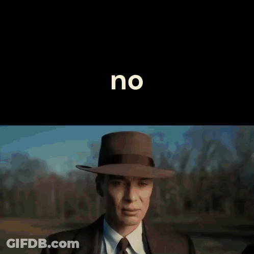 A Man In A Suit And Tie Holds His Hand To His Forehead In Front Of A Black Background With The Word No On It GIF
