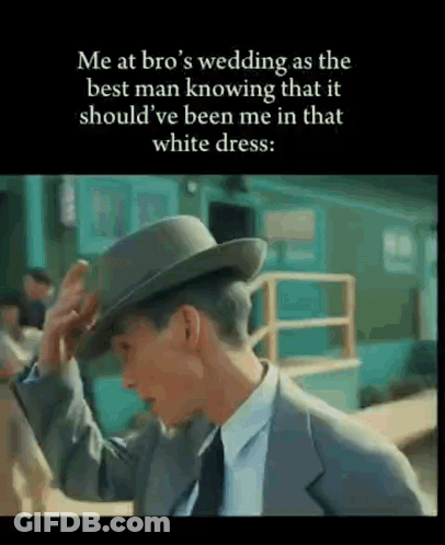 Man In Suit Adjusting Hat Talking About Brother's Wedding GIF