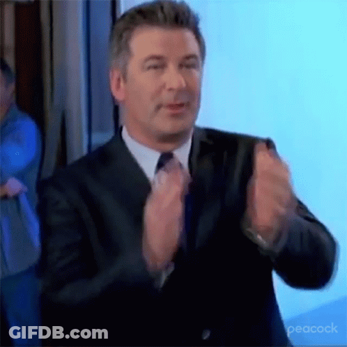 Man In Suit And Tie Applauding GIF