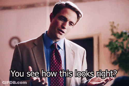 A Man In A Suit And Tie Is Asking How This Looks Right GIF