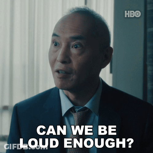 A Man In A Suit And Tie Is Asking If He Is Loud Enough GIF
