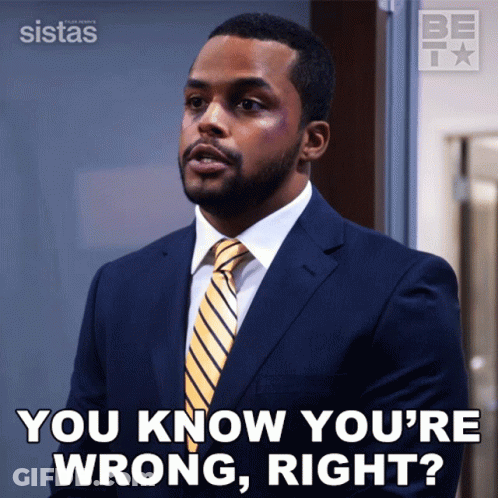 A Man In A Suit And Tie Is Asking If He Is Wrong GIF