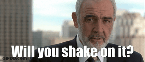 A Man In A Suit And Tie Is Asking If He Should Shake On It GIF