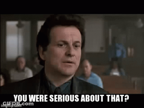 A Man In A Suit And Tie Is Asking If He Was Serious About That . GIF
