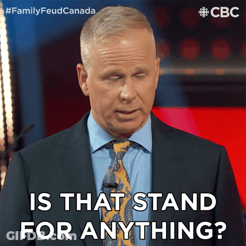 A Man In A Suit And Tie Is Asking If That Stand For Anything GIF