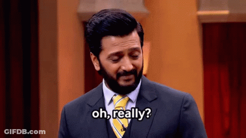 A Man In A Suit And Tie Is Asking " Oh Really " GIF