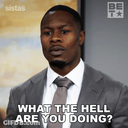 A Man In A Suit And Tie Is Asking " What The Hell Are You Doing " GIF