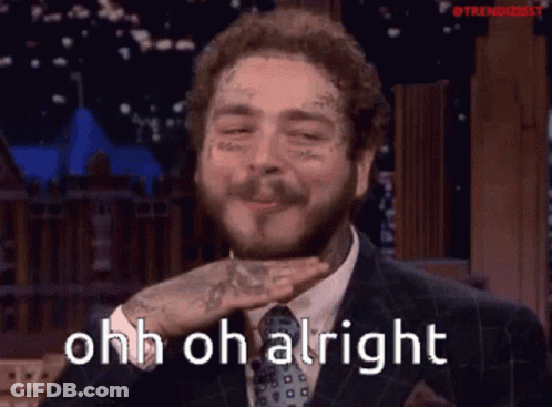 A Man In A Suit And Tie Is Blowing A Kiss With The Words Ohh Oh Alright Behind Him GIF