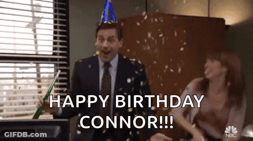 A Man In A Suit And Tie Is Celebrating His Birthday While A Woman Throws Confetti At Him . GIF