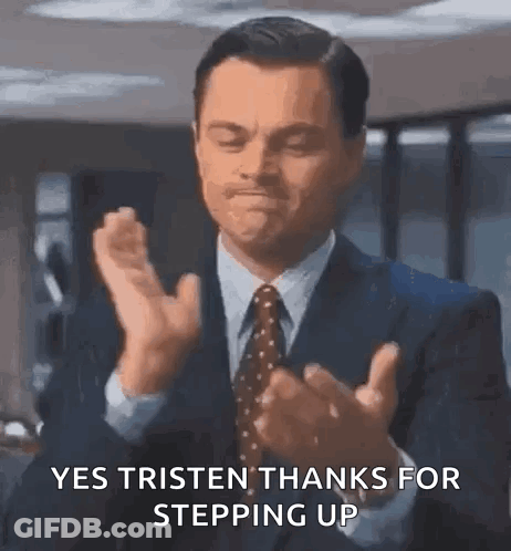A Man In A Suit And Tie Is Clapping His Hands And Saying `` Yes Tristen Thanks For Stepping Up '' . GIF