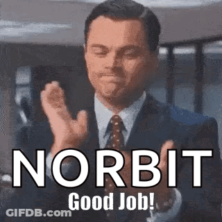 A Man In A Suit And Tie Is Clapping His Hands With The Words Norbit Good Job . GIF