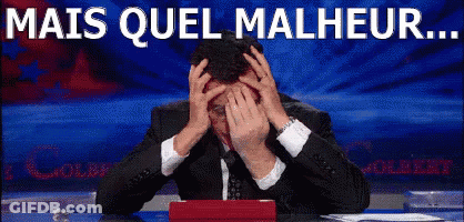 A Man In A Suit And Tie Is Covering His Face With His Hands And The Words Mais Quel Malheur Are Written Above Him GIF